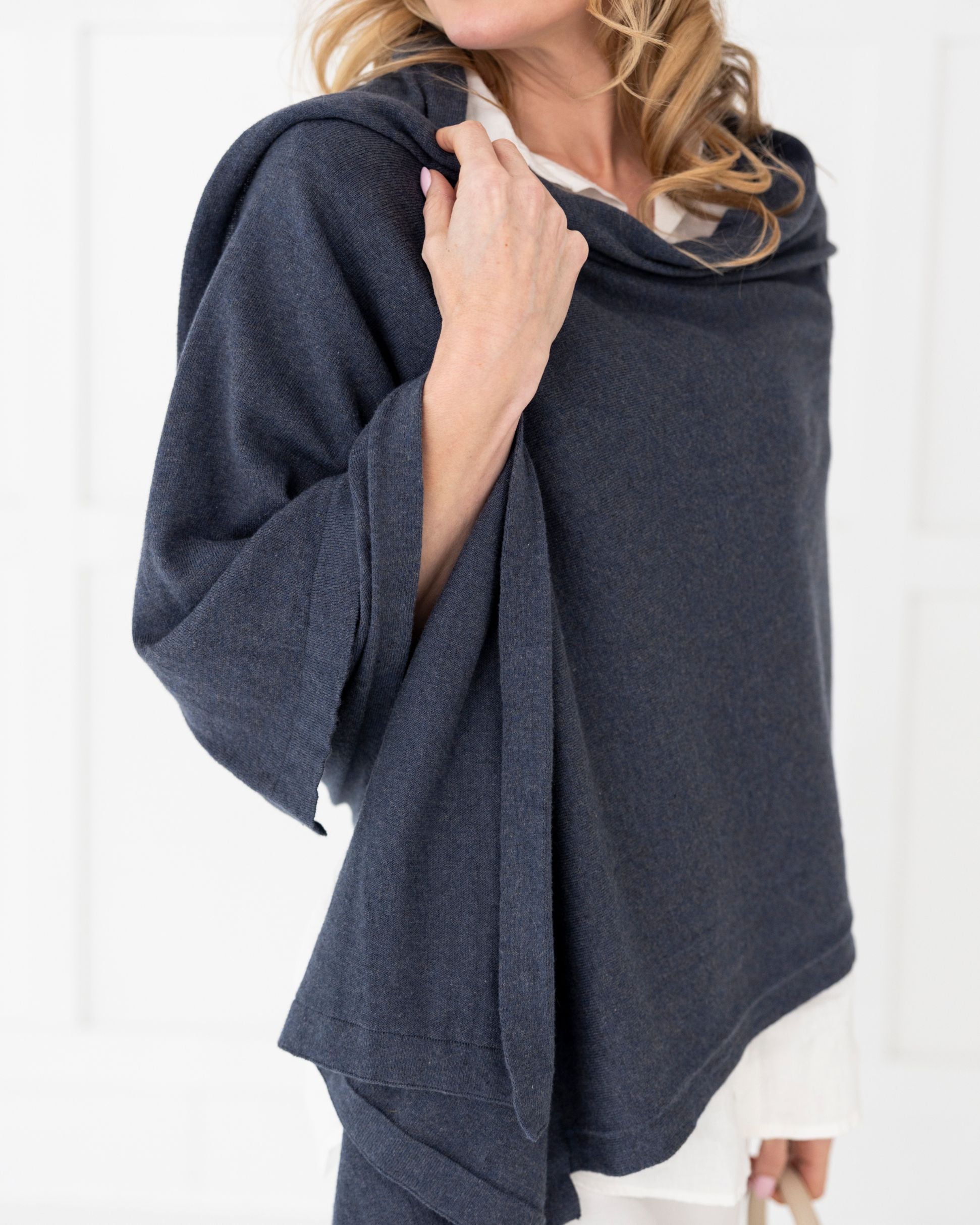 Woman wearing the Denim Dreamsoft Travel Scarf as a wrap
