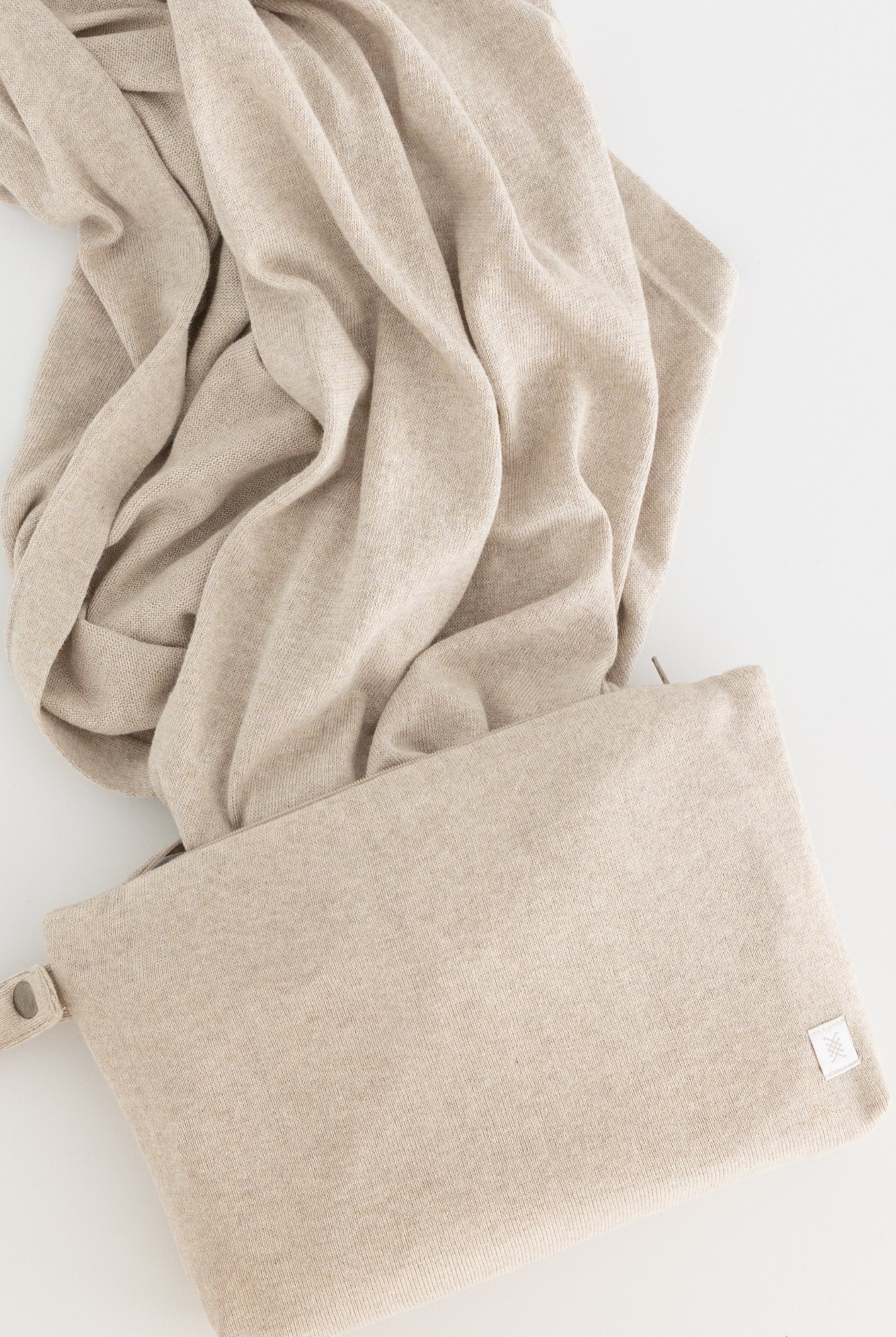 beige carry pouch shown with beige scarf