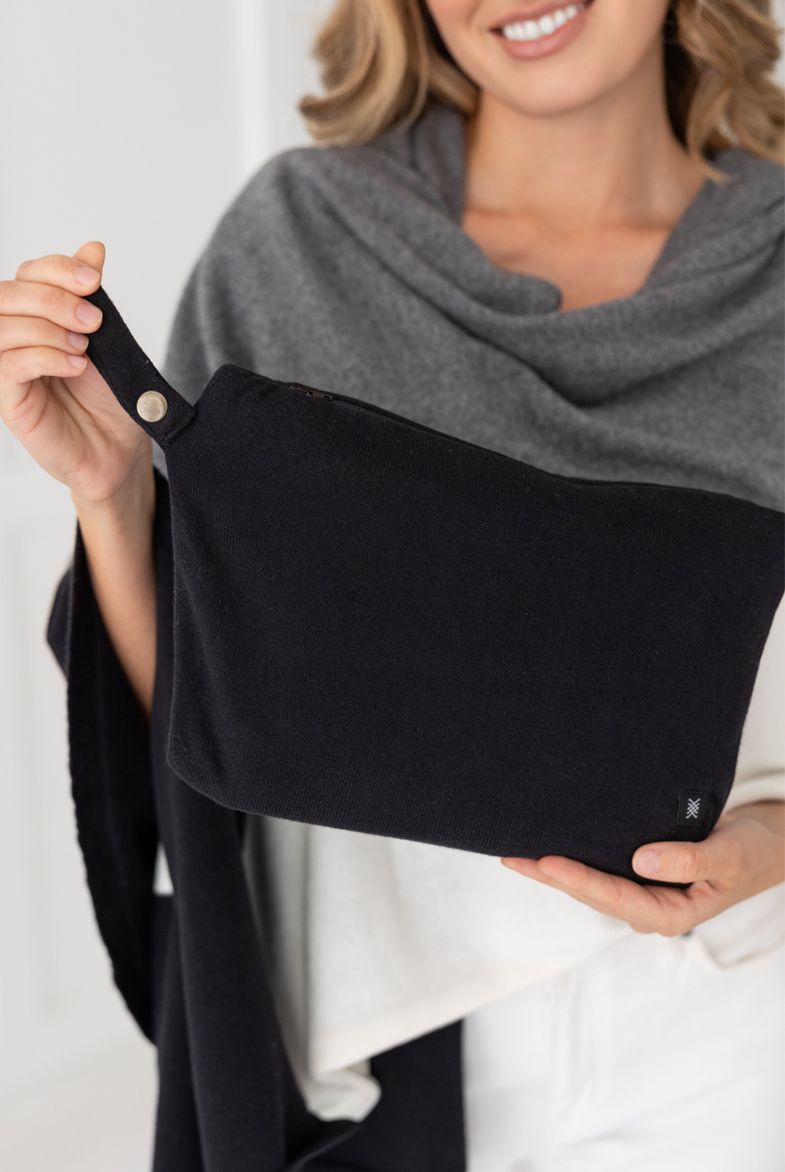 Woman shown holding the black carry pouch