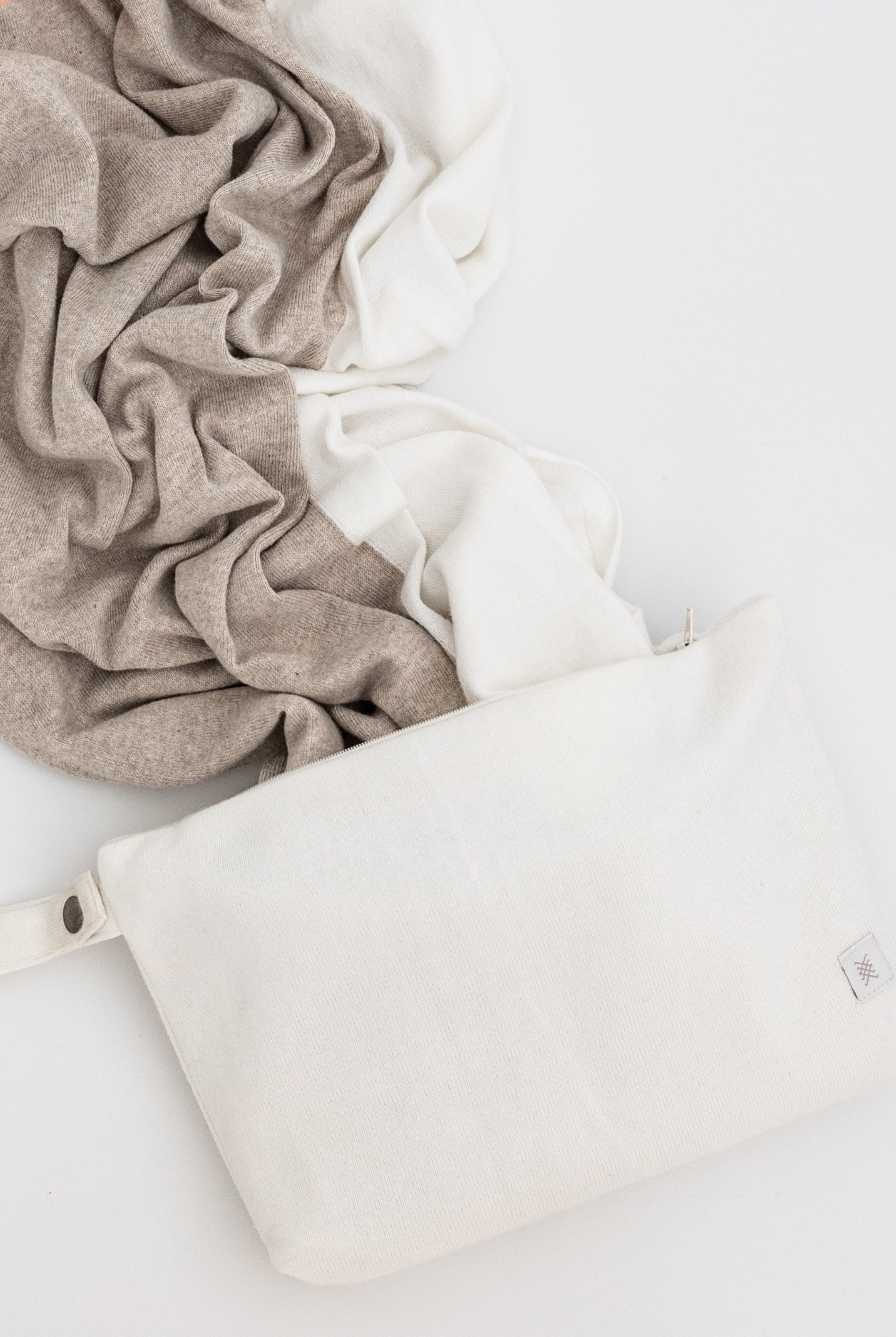 Ivory carry pouch shown with beige, Ivory scarf