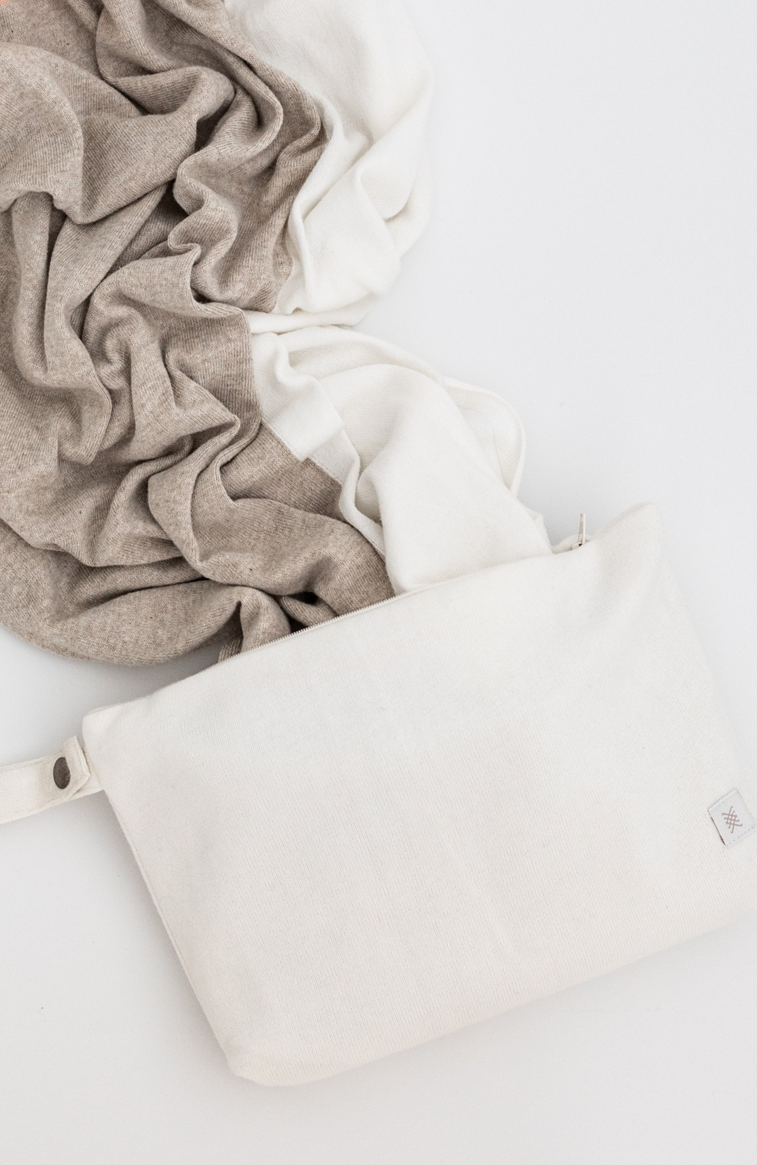 Ivory carry pouch shown with beige, Ivory scarf