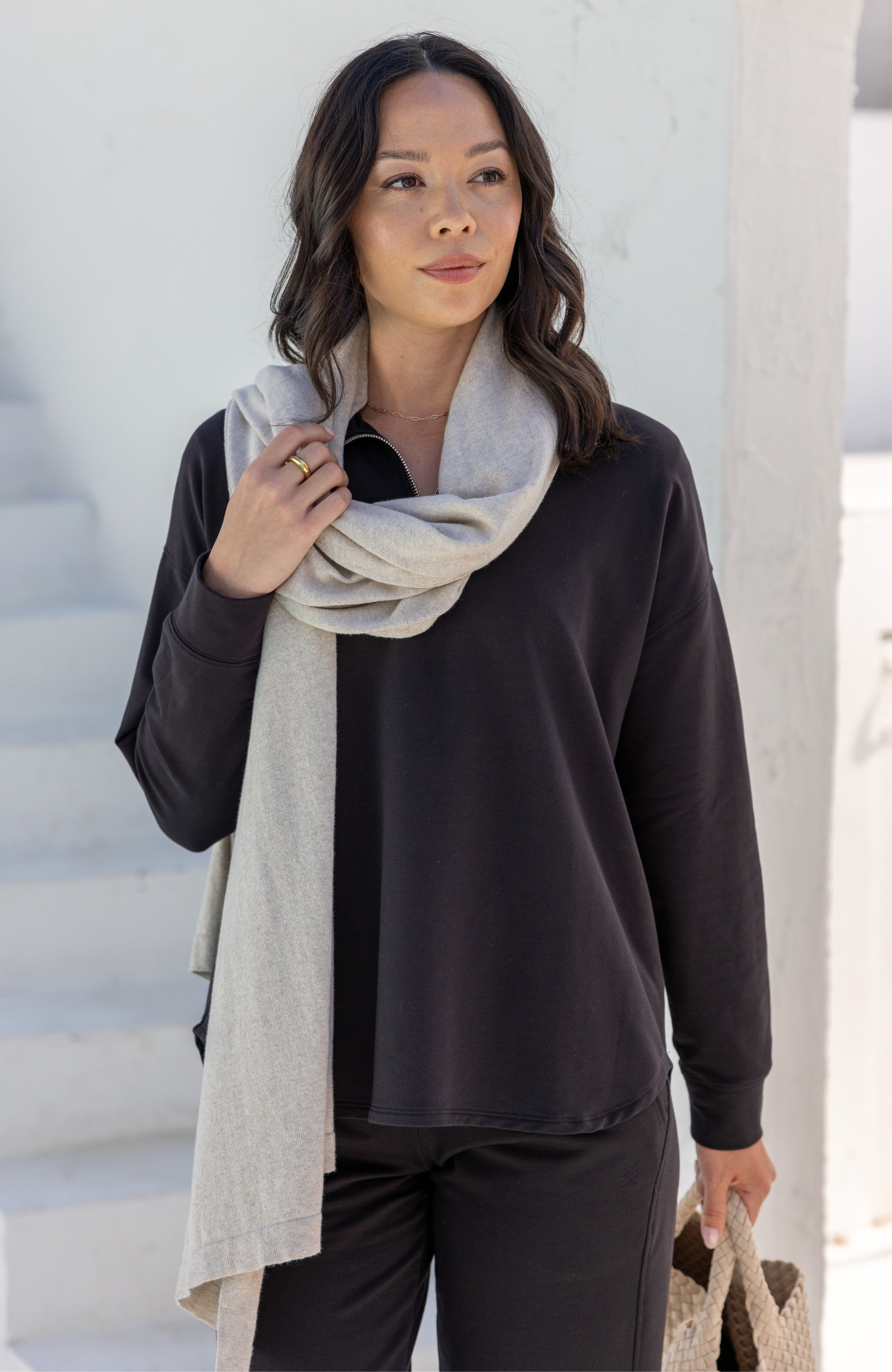 Woman wearing a Beige Scarf wrapped around her neck