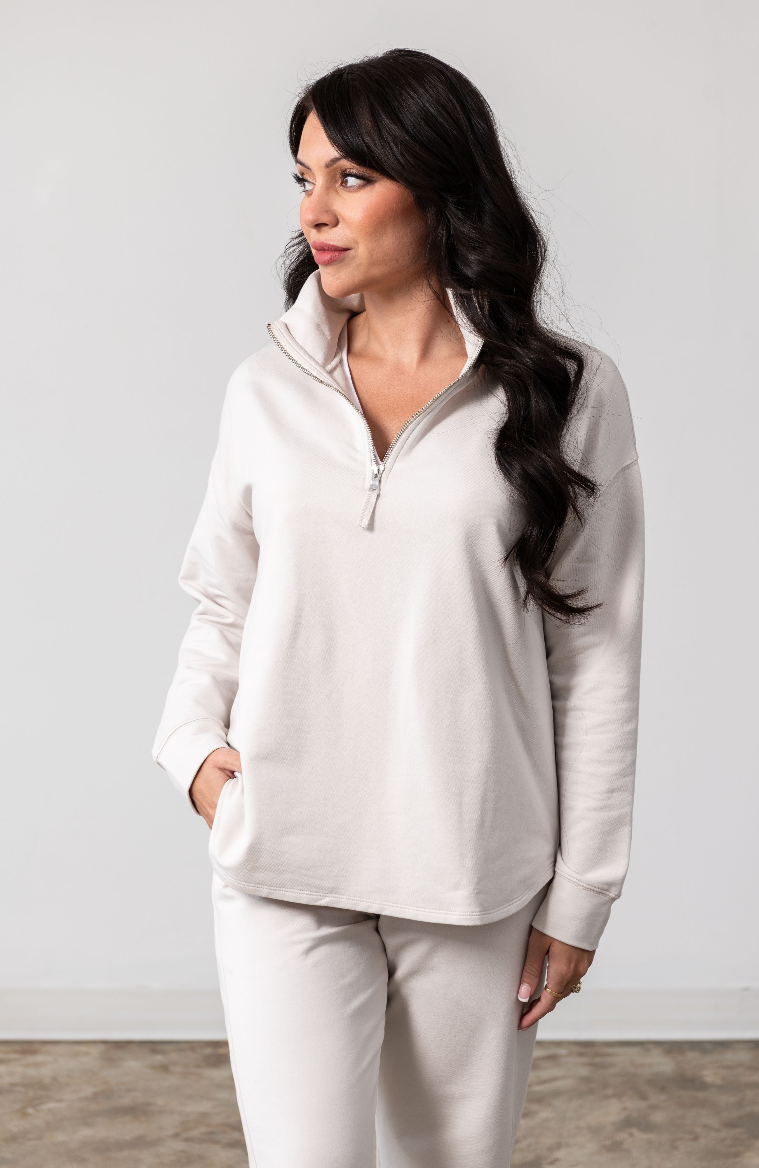 Women shown wearing a Beige Quarter zip pullover