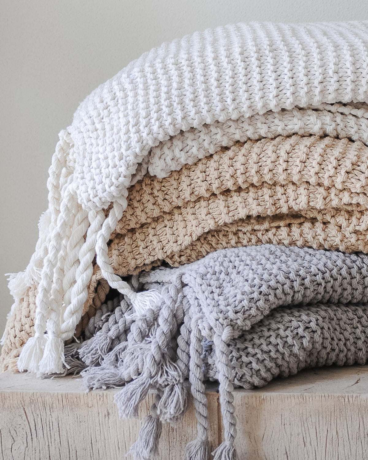 Organic Cotton Comfy Knit Throw shown in Soft White, Gray and Tan