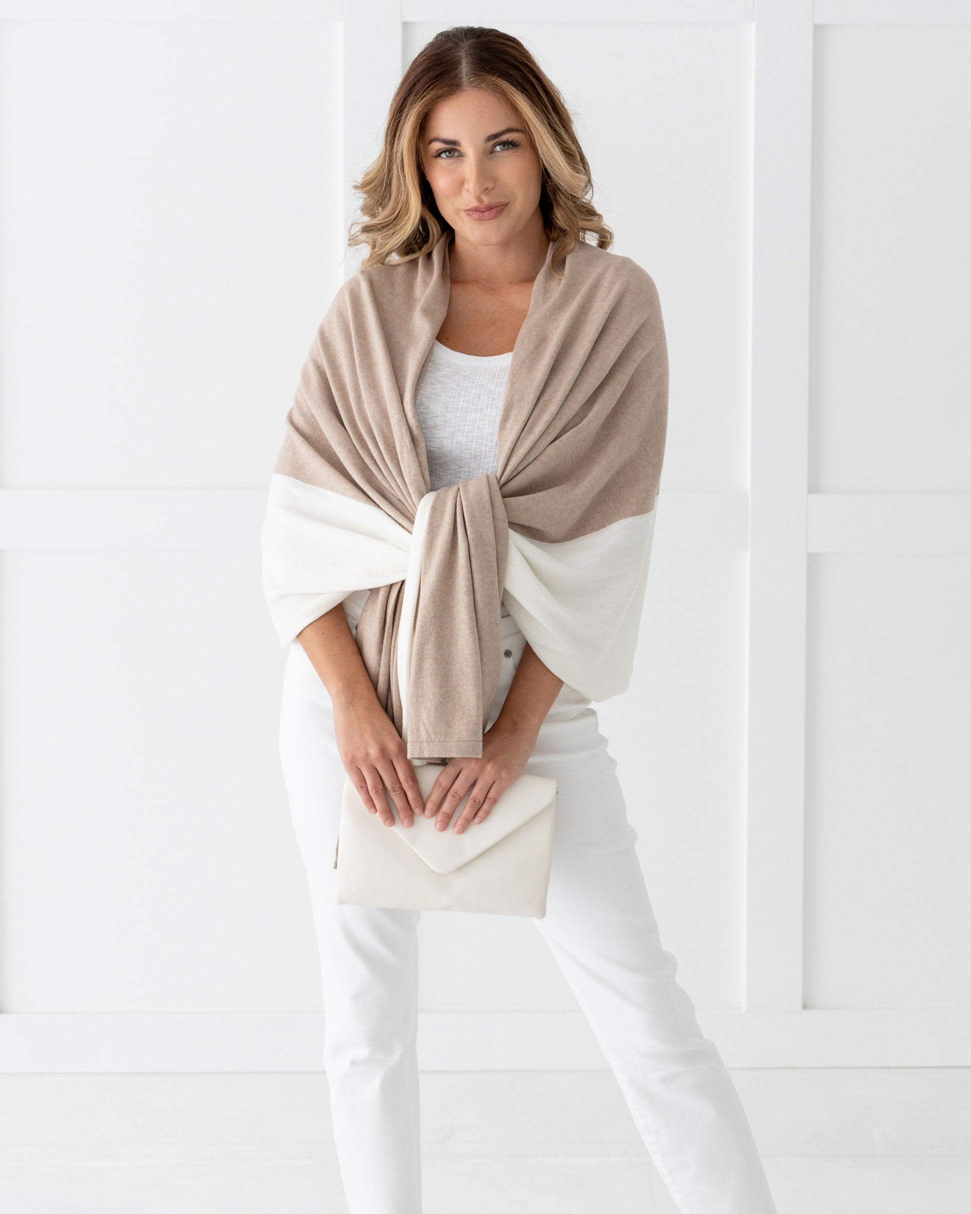 Woman wearing the Cashmere Cotton Luxe Travel Scarf in Sandstone and Ivory Colorblock which is a tan and cream scarf