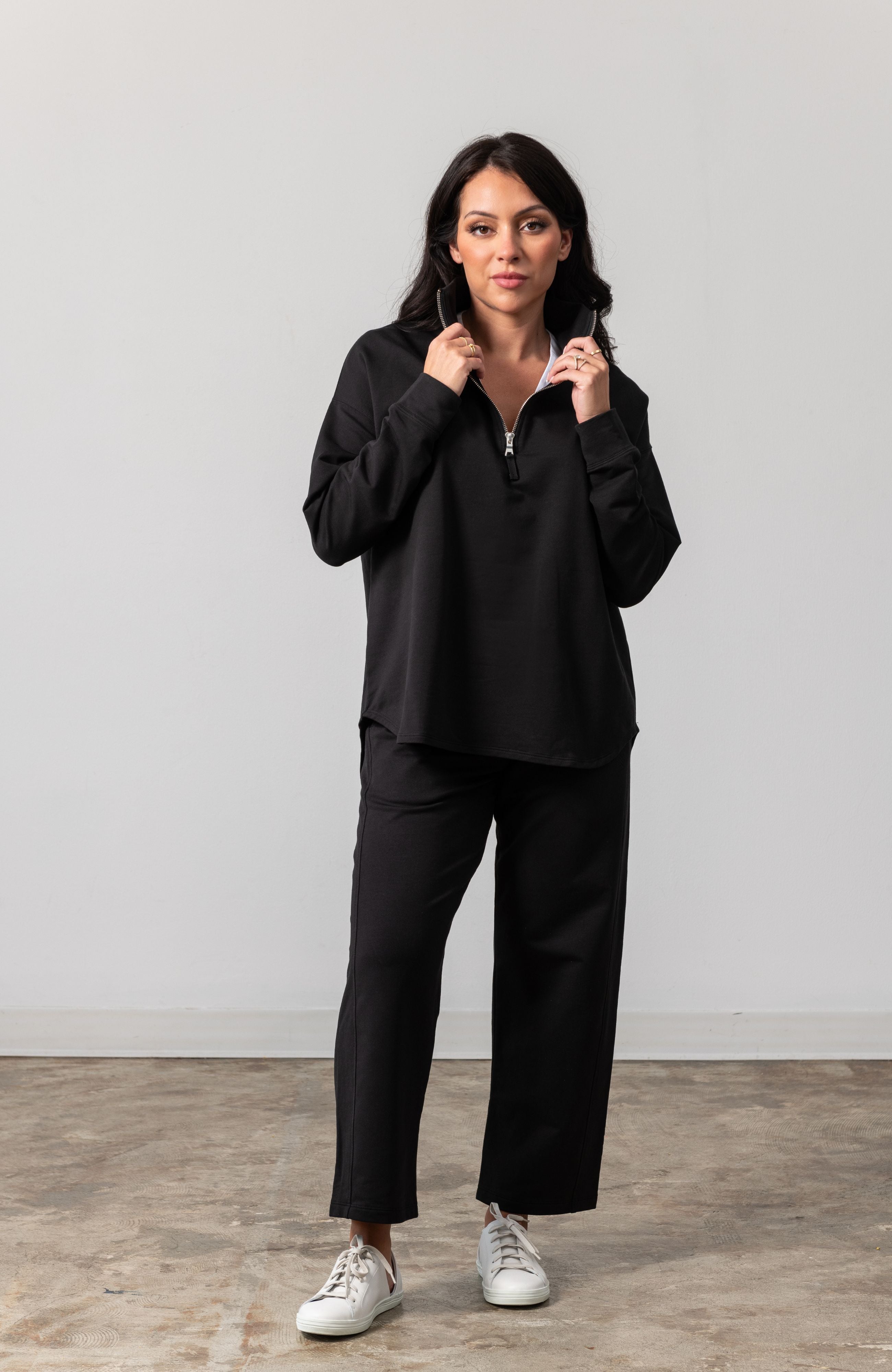 Women shown wearing Black Quarter zip pullover