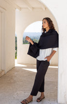 Woman wearing a Beige Scarf draped around her shoulders