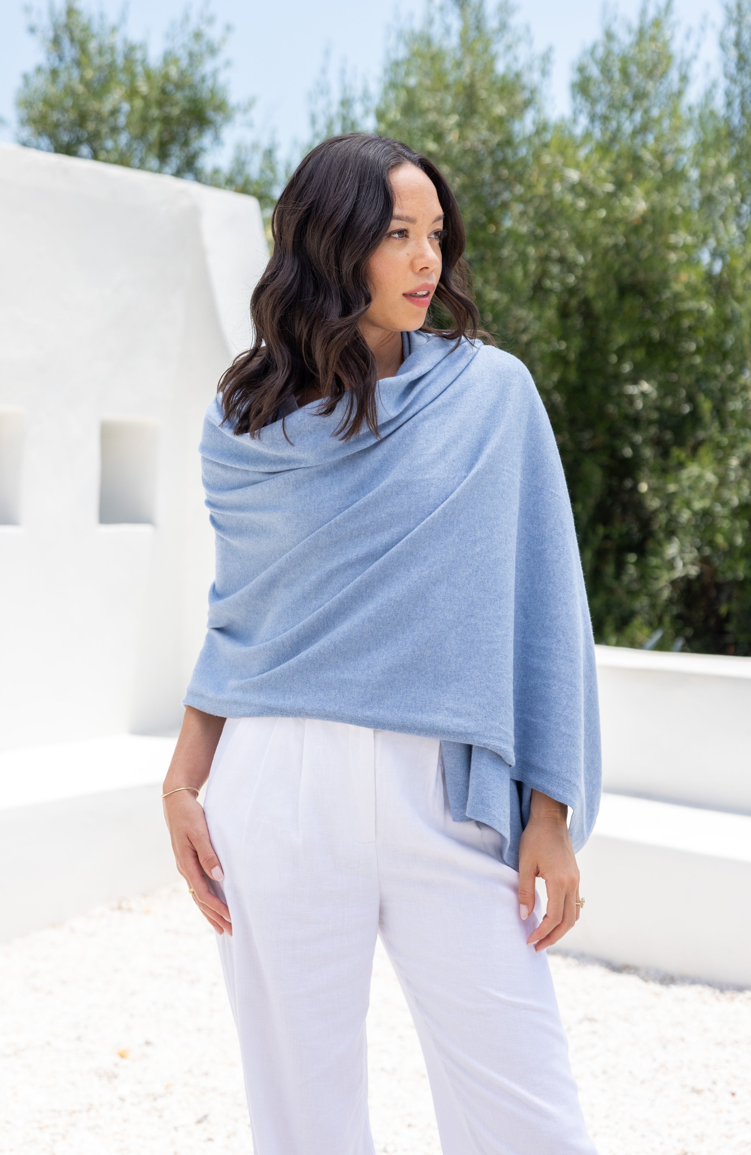 Woman shown wearing Light Blue Scarf wrapped around shoulders