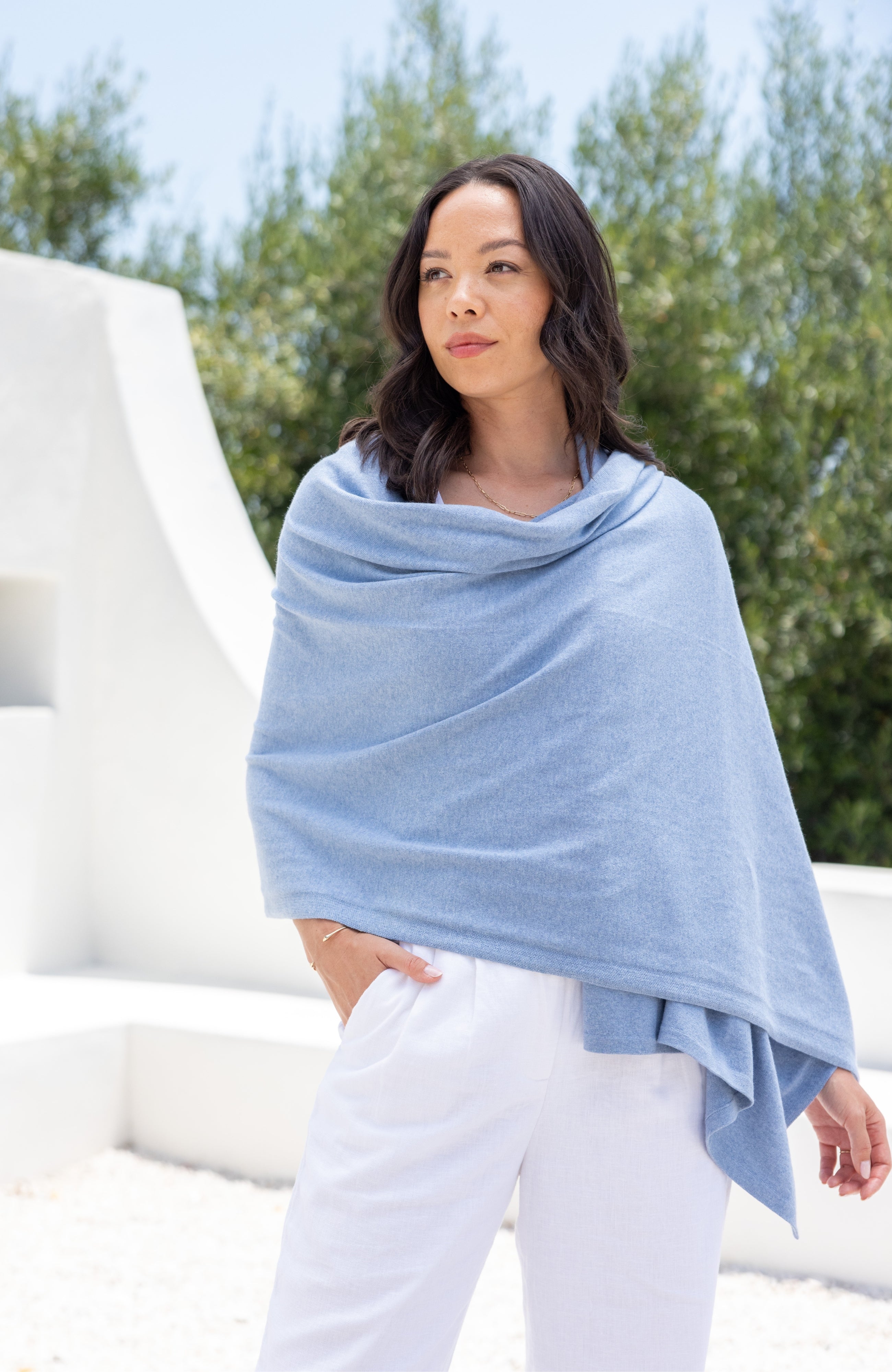 Woman shown wearing Light Blue Scarf wrapped around shoulders