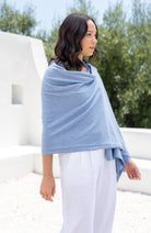 Woman shown wearing Light Blue Scarf wrapped around shoulders