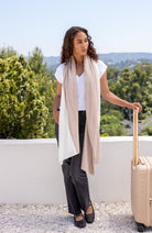 Woman shown wearing Ivory and Beige Scarf wrapped around neck