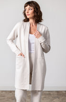 Woman shown wearing Light Beige cardigan